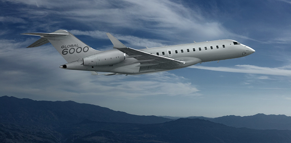 Bombardier 6000 flying above the clouds