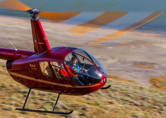 R44 flying in the sky