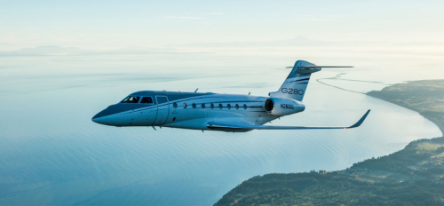 A Gulfstream G280 Flying Over a Water Body